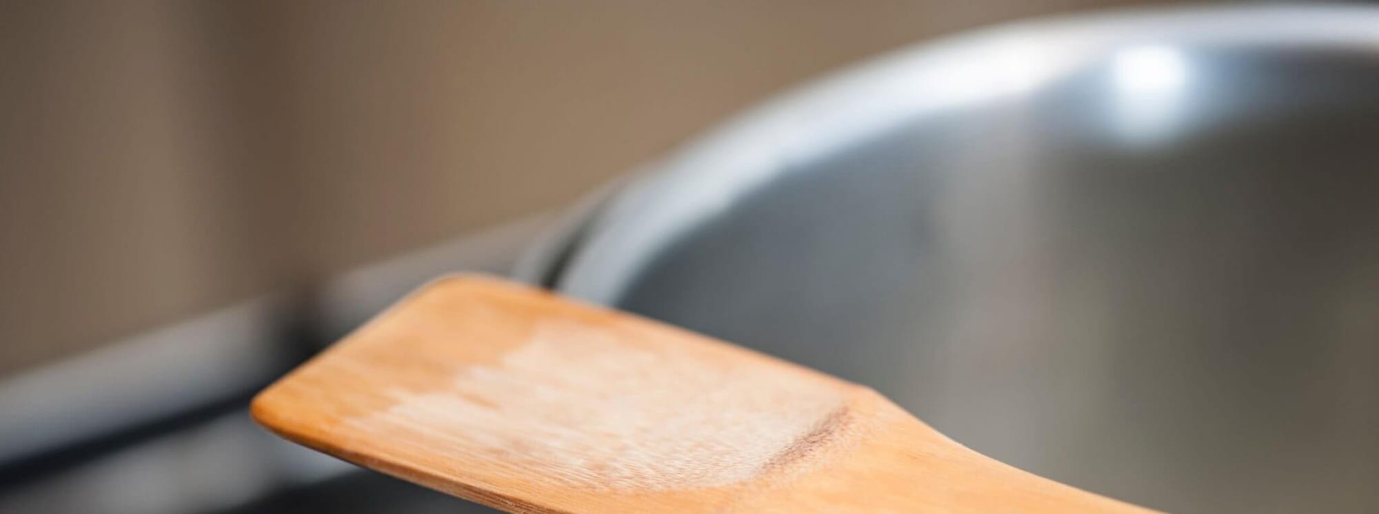 wooden spoon on pan